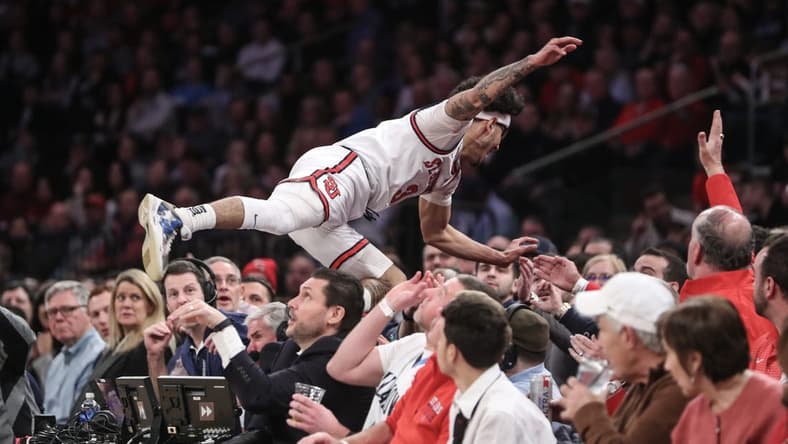Jan 20, 2023; New York, New York, USA; St. John's Red Storm guard Andre Curbelo (3) falls into the stands chasing a loose ball in the first half against the Villanova Wildcats at Madison Square Garden. Mandatory Credit: Wendell Cruz-USA TODAY Sports