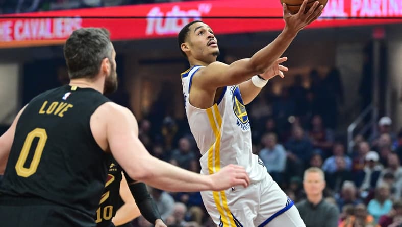 Jan 20, 2023; Cleveland, Ohio, USA; Golden State Warriors guard Jordan Poole (3) drives to the basket against the Cleveland Cavaliers during the first half at Rocket Mortgage FieldHouse. Mandatory Credit: Ken Blaze-USA TODAY Sports