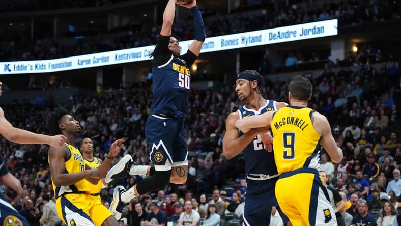 Jan 20, 2023; Denver, Colorado, USA; Denver Nuggets forward Aaron Gordon (50) finishes off a basket in the first quarter against the Indiana Pacers at Ball Arena. Mandatory Credit: Ron Chenoy-USA TODAY Sports