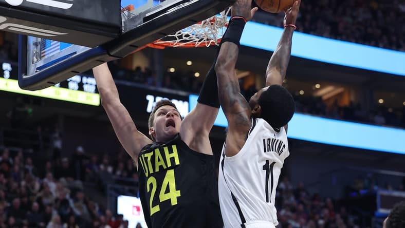 Jan 20, 2023; Salt Lake City, Utah, USA; Brooklyn Nets guard Kyrie Irving (11) drives to the basket against Utah Jazz center Walker Kessler (24) in the second quarter at Vivint Arena. Mandatory Credit: Rob Gray-USA TODAY Sports