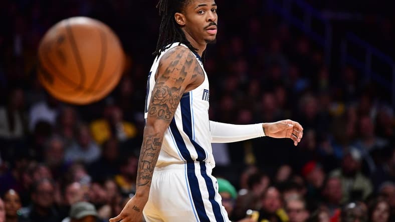 January 20, 2023; Los Angeles, California, USA; Memphis Grizzlies guard Ja Morant (12) reacts against the Los Angeles Lakers during the first half at Crypto.com Arena. Mandatory Credit: Gary A. Vasquez-USA TODAY Sports