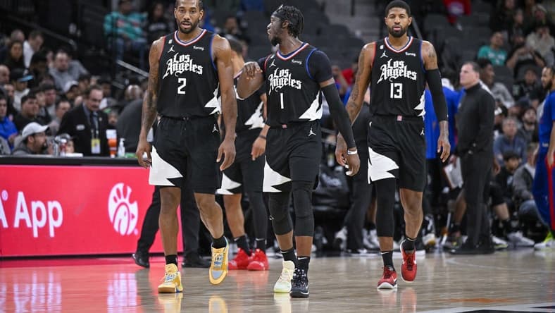 Jan 20, 2023; San Antonio, Texas, USA; LA Clippers forward Kawhi Leonard (2) and guard Reggie Jackson (1) and guard Paul George (13) walk back onto the court during the second half against the San Antonio Spurs at the AT&T Center. Mandatory Credit: Jerome Miron-USA TODAY Sports