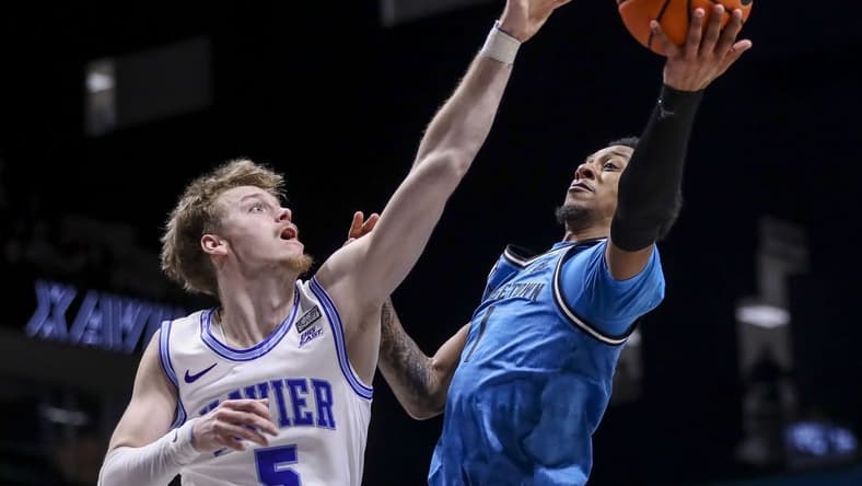 Jan 21, 2023; Cincinnati, Ohio, USA; Georgetown Hoyas guard Primo Spears (1) shoots against Xavier Musketeers guard Adam Kunkel (5) in the first half at Cintas Center. Mandatory Credit: Katie Stratman-USA TODAY Sports