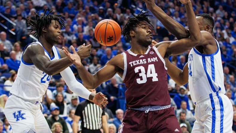 Jan 21, 2023; Lexington, Kentucky, USA; Texas A&M Aggies forward Julius Marble (34) goes after a loose ball during the first half against the Kentucky Wildcats at Rupp Arena at Central Bank Center. Mandatory Credit: Jordan Prather-USA TODAY Sports