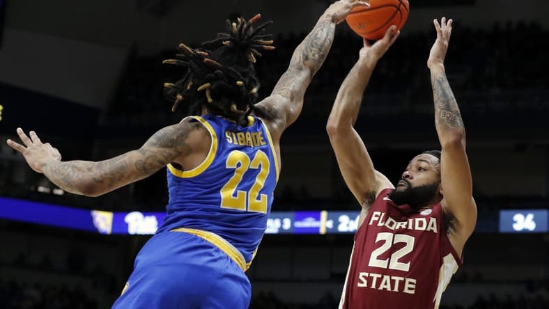 Jan 21, 2023; Pittsburgh, Pennsylvania, USA;  Florida State Seminoles guard Darin Green Jr. (22) shoots a three point basket against Pittsburgh Panthers guard Nike Sibande (22) during the first half at the Petersen Events Center. Mandatory Credit: Charles LeClaire-USA TODAY Sports
