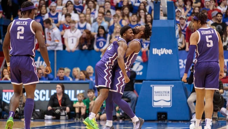 Jan 21, 2023; Lawrence, Kansas, USA; TCU Horned Frogs guard Mike Miles Jr. (1) hugs TCU Horned Frogs guard Shahada Wells (13) in reaction to a play during the second half against the Kansas Jayhawks at Allen Fieldhouse. Mandatory Credit: William Purnell-USA TODAY Sports