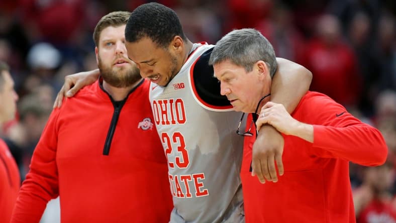 Jan 21, 2023; Columbus, Ohio, USA; Ohio State Buckeyes forward Zed Key (23) leaves the court with a knee injury during the second half against the Iowa Hawkeyes at Value City Arena. Mandatory Credit: Joseph Maiorana-USA TODAY Sports