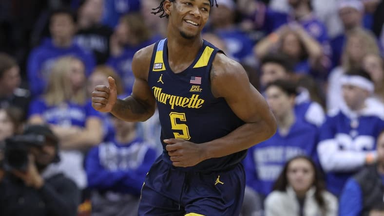 Jan 21, 2023; Newark, New Jersey, USA; Marquette Golden Eagles guard Chase Ross (5) reacts after a basket against the Seton Hall Pirates during the second half at Prudential Center. Mandatory Credit: Vincent Carchietta-USA TODAY Sports