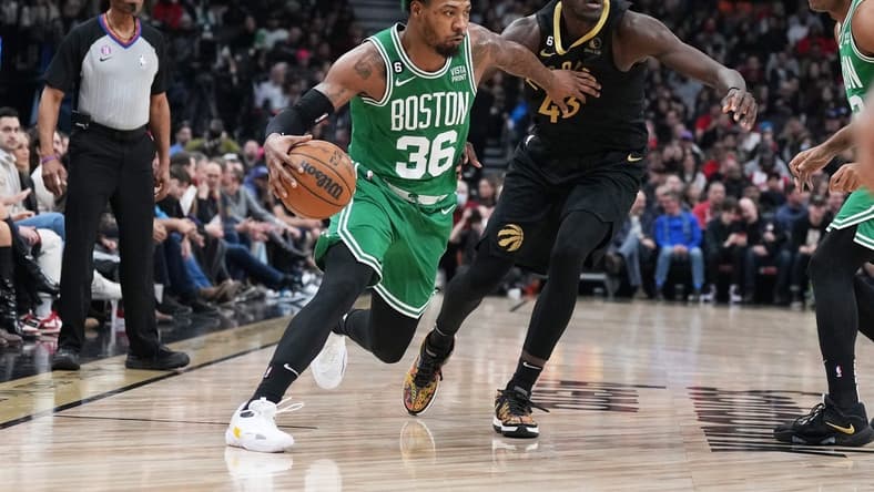 Jan 21, 2023; Toronto, Ontario, CAN; Boston Celtics guard Marcus Smart (36) controls the ball as Toronto Raptors forward Pascal Siakam (43) defends during the second quarter at Scotiabank Arena. Mandatory Credit: Nick Turchiaro-USA TODAY Sports