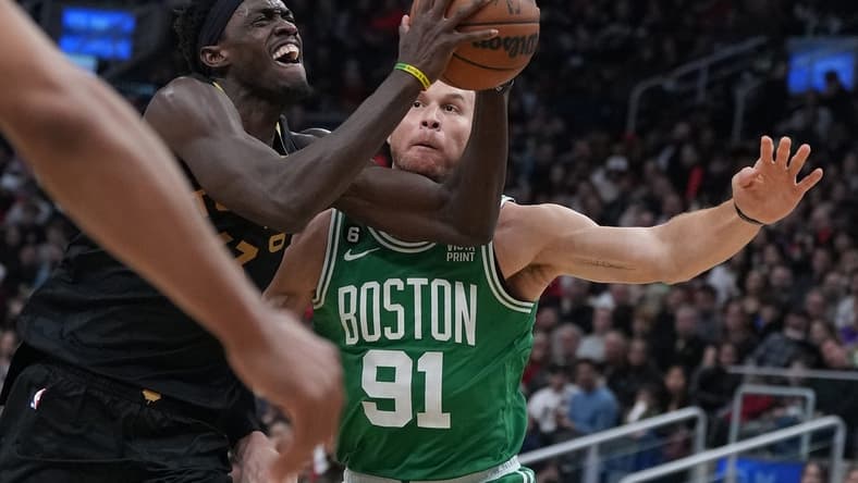 Jan 21, 2023; Toronto, Ontario, CAN; Toronto Raptors forward Pascal Siakam (43) drives to the basket as Boston Celtics forward Blake Griffin (91) defends during the third quarter at Scotiabank Arena. Mandatory Credit: Nick Turchiaro-USA TODAY Sports