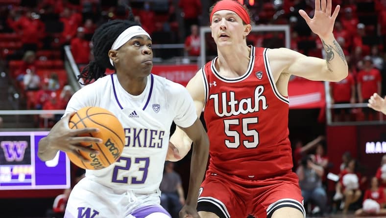 Jan 21, 2023; Salt Lake City, Utah, USA; Washington Huskies guard Keyon Menifield (23) drives to the basket against Utah Utes guard Gabe Madsen (55) in the first half at Jon M. Huntsman Center. Mandatory Credit: Rob Gray-USA TODAY Sports