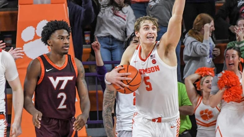 January 21, 2023; Clemson, SC; Clemson forward Hunter Tyson (5) holds on to a rebound near Virginia Tech guard Michael Collins Jr (2) as time expired at Littlejohn Coliseum in Clemson, S.C. Saturday, January 21, 2023. Hunter made the go-ahead three-point shot and rebound in the end helping the Tigers win 51-50. Mandatory Credit: Ken Ruinard-USA TODAY NETWORK