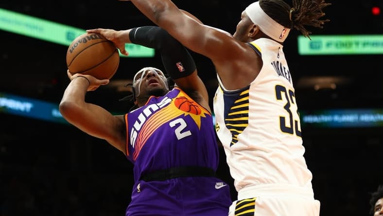 Jan 21, 2023; Phoenix, Arizona, USA; Indiana Pacers center Myles Turner (33) defends against Phoenix Suns forward Josh Okogie (2) in the first half at Footprint Center. Mandatory Credit: Mark J. Rebilas-USA TODAY Sports