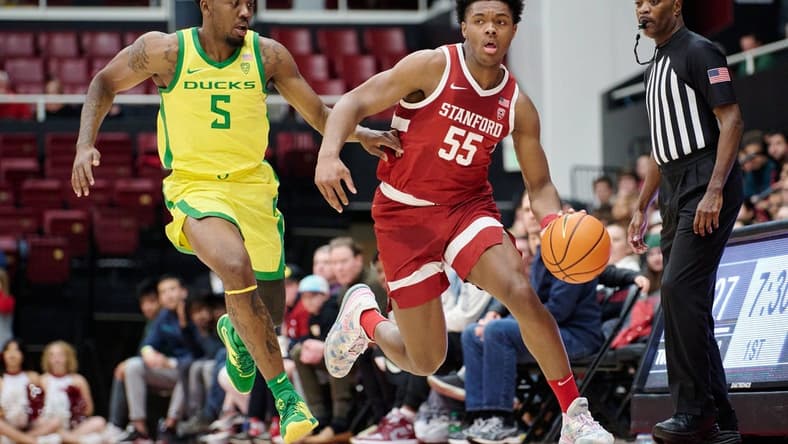 Jan 21, 2023; Stanford, California, USA; Stanford Cardinal forward Harrison Ingram (55) dribbles against Oregon Ducks guard Jermaine Couisnard (5) during the first half at Maples Pavilion. Mandatory Credit: Robert Edwards-USA TODAY Sports
