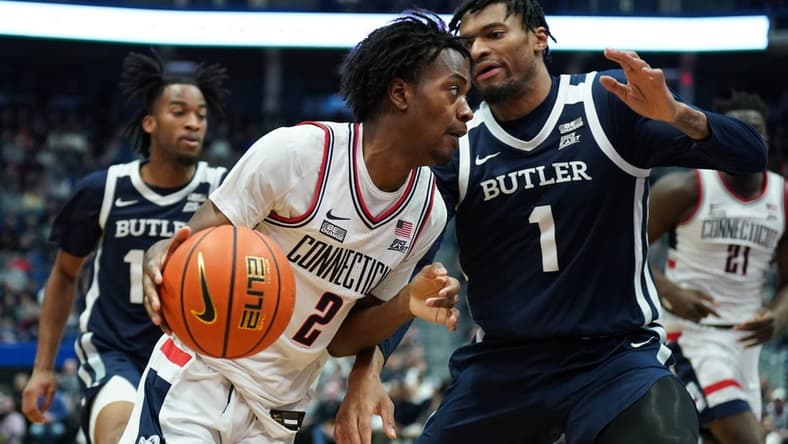 Jan 22, 2023; Hartford, Connecticut, USA; UConn Huskies guard Tristen Newton (2) drives the ball against Butler Bulldogs forward Jalen Thomas (1) in the first half at XL Center. Mandatory Credit: David Butler II-USA TODAY Sports