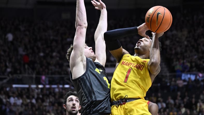 Jan 22, 2023; West Lafayette, Indiana, USA; Maryland Terrapins guard Jahmir Young (1) shoots the ball against Purdue Boilermakers forward Caleb Furst (1) during the first half at Mackey Arena. Mandatory Credit: Marc Lebryk-USA TODAY Sports