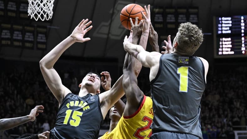9Jan 22, 2023; West Lafayette, Indiana, USA; Purdue Boilermakers center Zach Edey (15) and forward Caleb Furst (1) fights for a rebound against Maryland Terrapins forward Donta Scott (24) during the second half at Mackey Arena. Mandatory Credit: Marc Lebryk-USA TODAY Sports