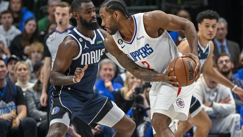 Jan 22, 2023; Dallas, Texas, USA; LA Clippers forward Kawhi Leonard (2) looks to move the ball past Dallas Mavericks forward Tim Hardaway Jr. (11) during the first half at the American Airlines Center. Mandatory Credit: Jerome Miron-USA TODAY Sports