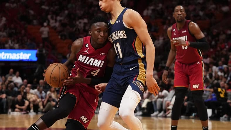 Jan 22, 2023; Miami, Florida, USA; Miami Heat guard Victor Oladipo (4) drives the ball against New Orleans Pelicans guard Dyson Daniels (11) during the first half at Miami-Dade Arena. Mandatory Credit: Jasen Vinlove-USA TODAY Sports
