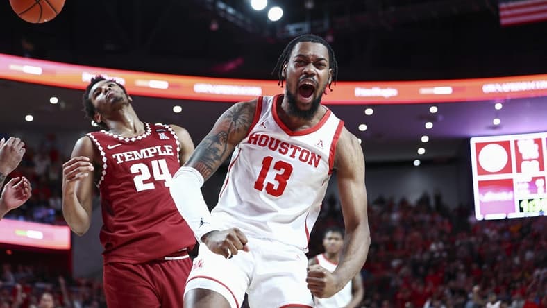 Jan 22, 2023; Houston, Texas, USA; Houston Cougars forward J'Wan Roberts (13) reacts after a play during the second half against the Temple Owls at Fertitta Center. Mandatory Credit: Troy Taormina-USA TODAY Sports
