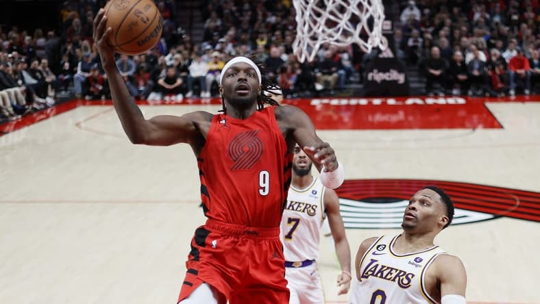 Jan 22, 2023; Portland, Oregon, USA; Portland Trail Blazers small forward Jerami Grant (9) drives to the basket past Los Angeles Lakers point guard Russell Westbrook (0) during the first half at Moda Center. Mandatory Credit: Soobum Im-USA TODAY Sports