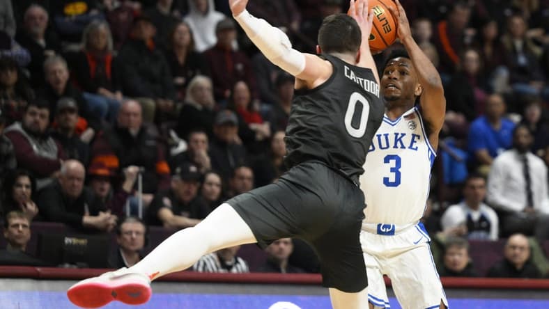 Jan 23, 2023; Blacksburg, Virginia, USA; Duke Blue Devils guard Jeremy Roach (3) shoots against Virginia Tech Hokies guard Hunter Cattoor (0) in the first half at Cassell Coliseum. Mandatory Credit: Lee Luther Jr.-USA TODAY Sports