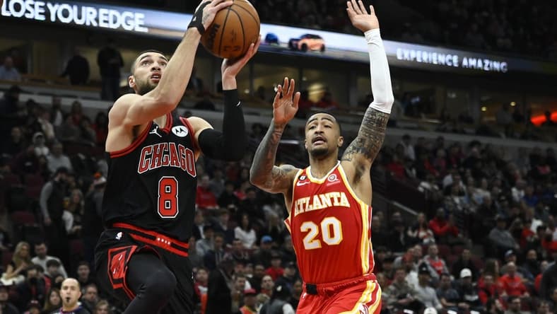 Jan 23, 2023; Chicago, Illinois, USA; Chicago Bulls guard Zach LaVine (8) goes to the basket against Atlanta Hawks forward John Collins (20) during the first half at the United Center. Mandatory Credit: Matt Marton-USA TODAY Sports