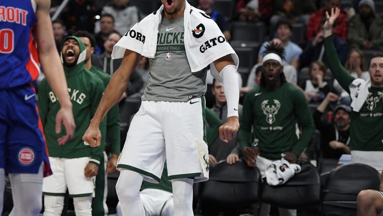 Jan 23, 2023; Detroit, Michigan, USA; Milwaukee Bucks forward Giannis Antetokounmpo's (34) reacts from the bench after his brother Thanasis (not pictured) made a basket against the Detroit Pistons in the fourth quarter at Little Caesars Arena. Mandatory Credit: Lon Horwedel-USA TODAY Sports