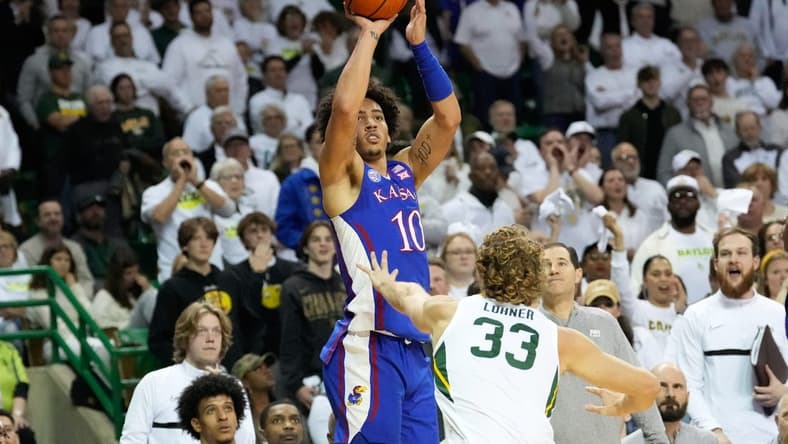 Jan 23, 2023; Waco, Texas, USA; Kansas Jayhawks forward Jalen Wilson (10) scores a three-point basket against Baylor Bears forward Caleb Lohner (33) during the first half at Ferrell Center. Mandatory Credit: Chris Jones-USA TODAY Sports