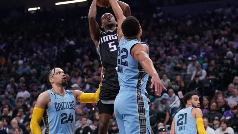 Jan 23, 2023; Sacramento, California, USA; Sacramento Kings guard De'Aaron Fox (5) makes a shot over Memphis Grizzlies guard Desmond Bane (22) in the first quarter at the Golden 1 Center. Mandatory Credit: Cary Edmondson-USA TODAY Sports