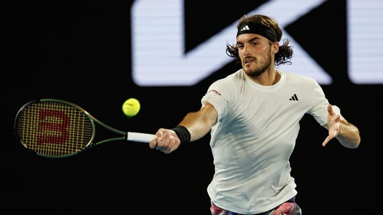 Jan 24, 2023; Melbourne, Victoria, Australia;  Stefanos Tsitsipas of Greece hits a shot against Jiri Lehecka of the Czech Republic on day nine of the 2023 Australian Open tennis tournament at Melbourne Park. Mandatory Credit: Mike Frey-USA TODAY Sports