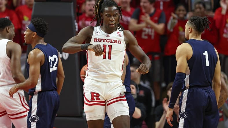 Jan 24, 2023; Piscataway, New Jersey, USA; Rutgers Scarlet Knights center Clifford Omoruyi (11) reacts after a basket during the first half in front of Penn State Nittany Lions guard Seth Lundy (1) at Jersey Mike's Arena. Mandatory Credit: Vincent Carchietta-USA TODAY Sports