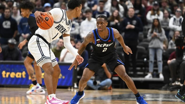 Jan 24, 2023; Washington, District of Columbia, USA; Georgetown Hoyas guard Primo Spears (1) dribbles as DePaul Blue Demons guard Umoja Gibson (2) defends during the first half at Capital One Arena. Mandatory Credit: Brad Mills-USA TODAY Sports