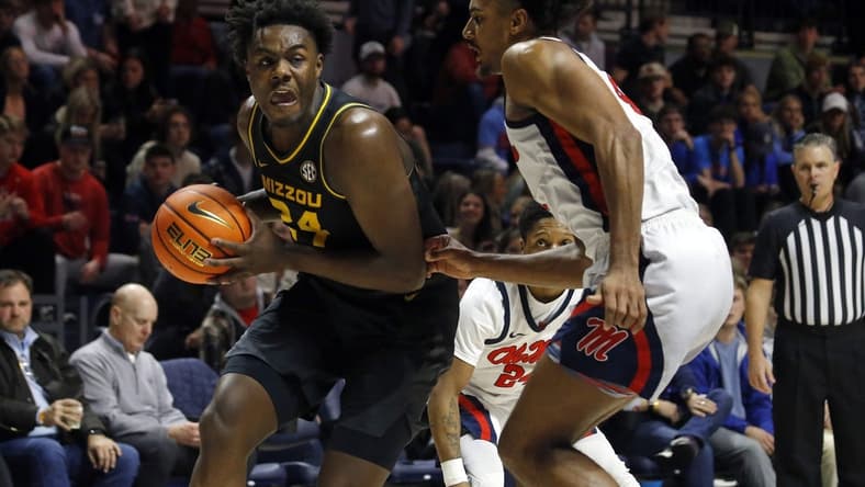 Jan 24, 2023; Oxford, Mississippi, USA; Missouri Tigers guard/forward Kobe Brown (24) drives to the basket as Mississippi Rebels forward Jaemyn Brakefield (4) defends during the first half at The Sandy and John Black Pavilion at Ole Miss. Mandatory Credit: Petre Thomas-USA TODAY Sports