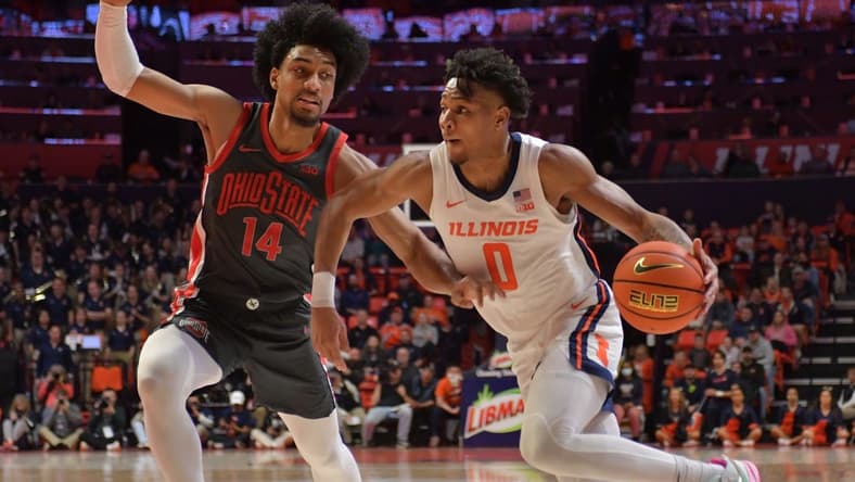 Jan 24, 2023; Champaign, Illinois, USA; Illinois Fighting Illini guard Terrence Shannon Jr. (0) drives the ball against Ohio State Buckeyes forward Justice Sueing (14) during the first half at State Farm Center. Mandatory Credit: Ron Johnson-USA TODAY Sports