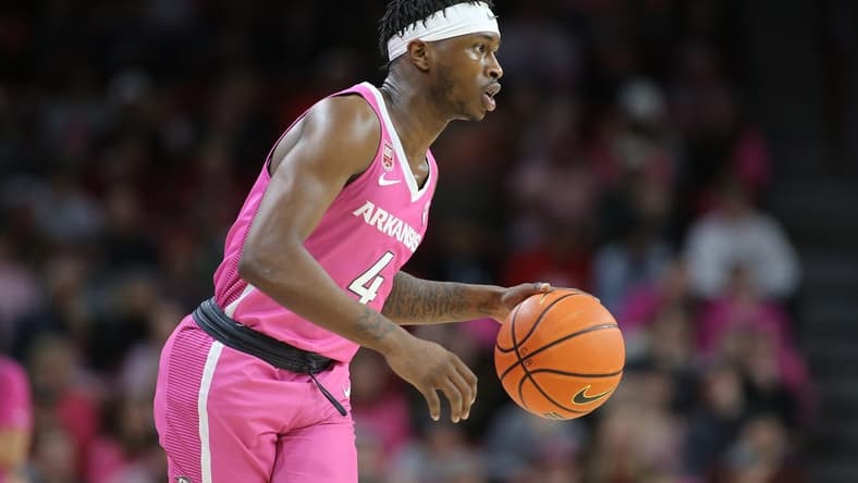 Jan 24, 2023; Fayetteville, Arkansas, USA; Arkansas Razorbacks guard Davonte Davis (4) dribbles during the first half against the LSU Tigers at Bud Walton Arena. Mandatory Credit: Nelson Chenault-USA TODAY Sports