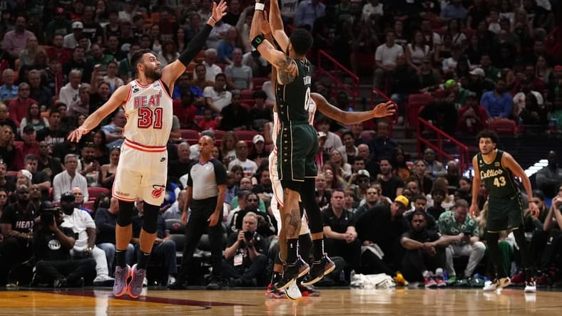 Jan 24, 2023; Miami, Florida, USA; Boston Celtics forward Jayson Tatum (0) attempts a three point shot over Miami Heat guard Max Strus (31) during the first half at Miami-Dade Arena. Mandatory Credit: Jasen Vinlove-USA TODAY Sports