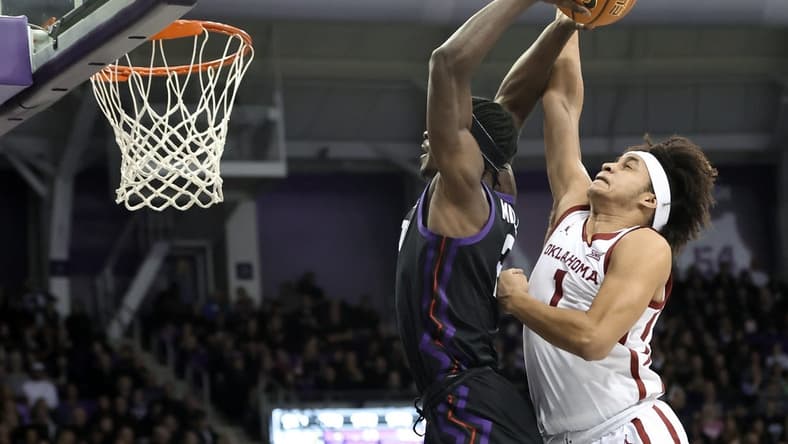 Jan 24, 2023; Fort Worth, Texas, USA; Oklahoma Sooners forward Jalen Hill (1) defends the shot of TCU Horned Frogs forward Emanuel Miller (2) during the first half at Ed and Rae Schollmaier Arena. Mandatory Credit: Kevin Jairaj-USA TODAY Sports