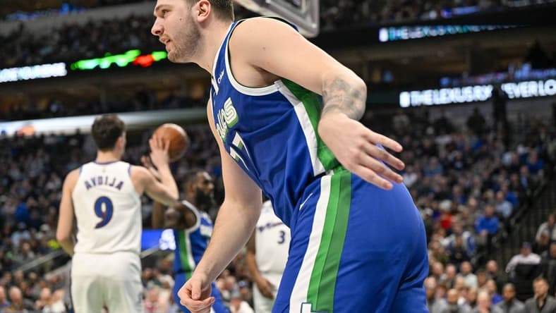 Jan 24, 2023; Dallas, Texas, USA; Dallas Mavericks guard Luka Doncic (77) runs back up the court after scoring against the Washington Wizards during the second quarter at the American Airlines Center. Mandatory Credit: Jerome Miron-USA TODAY Sports