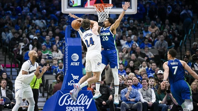 Jan 24, 2023; Dallas, Texas, USA; Washington Wizards forward Corey Kispert (24) looks to move to the basket past Dallas Mavericks guard Spencer Dinwiddie (26) during the second quarter at the American Airlines Center. Mandatory Credit: Jerome Miron-USA TODAY Sports