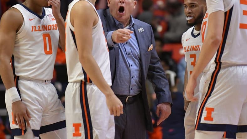 Jan 24, 2023; Champaign, Illinois, USA; Illinois Fighting Illini head coach Brad Underwood directs his players during the first half against the Ohio State Buckeyes at State Farm Center. Mandatory Credit: Ron Johnson-USA TODAY Sports