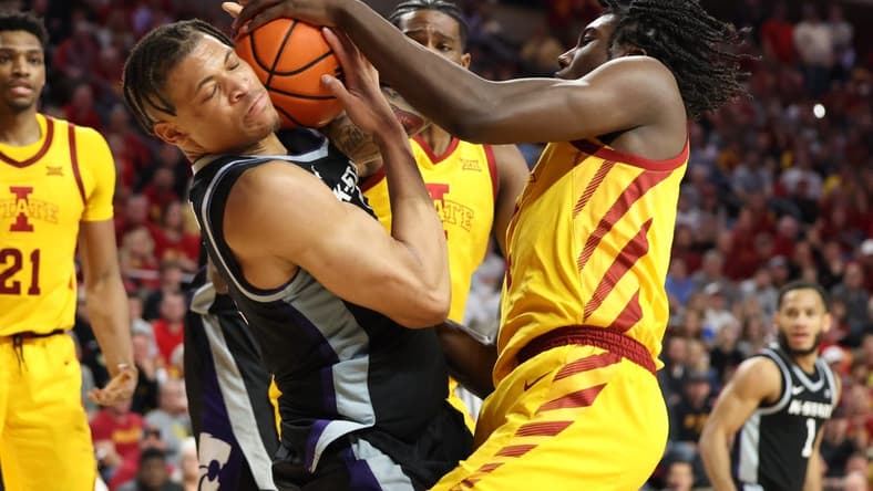 Jan 24, 2023; Ames, Iowa, USA; Iowa State Cyclones forward Robert Jones (12) and Kansas State Wildcats forward Keyontae Johnson (11) battle for a rebound during the second half at James H. Hilton Coliseum. The Cyclones won 80-76. Mandatory Credit: Reese Strickland-USA TODAY Sports