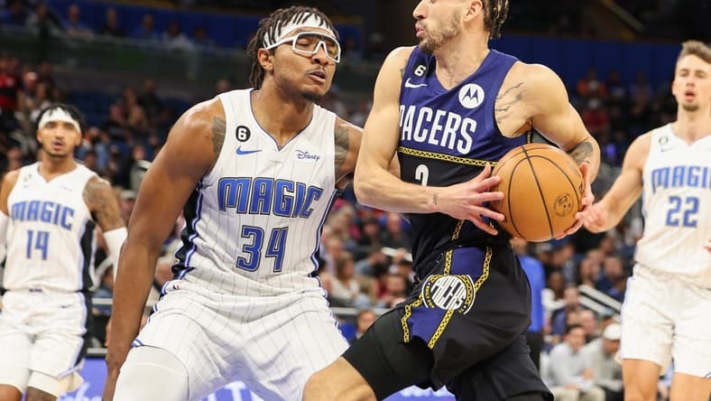 Jan 25, 2023; Orlando, Florida, USA; Indiana Pacers guard Chris Duarte (3) drives to the hoop guarded by Orlando Magic center Wendell Carter Jr. (34) in the first quarter at Amway Center. Mandatory Credit: Nathan Ray Seebeck-USA TODAY Sports