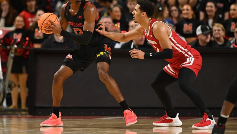 Jan 25, 2023; College Park, Maryland, USA;  Maryland Terrapins guard Hakim Hart (13) looks to move the ball as Wisconsin Badgers guard Jordan Davis (2) defends during the first half at Xfinity Center. Mandatory Credit: Tommy Gilligan-USA TODAY Sports