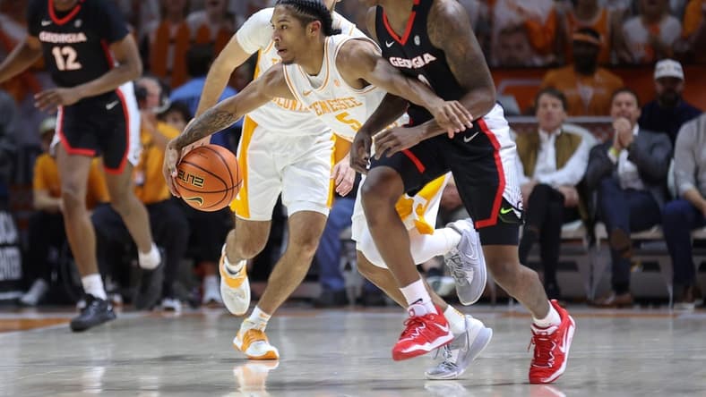 Jan 25, 2023; Knoxville, Tennessee, USA; Tennessee Volunteers guard Zakai Zeigler (5) steals the ball against the Georgia Bulldogs during the first half at Thompson-Boling Arena. Mandatory Credit: Randy Sartin-USA TODAY Sports
