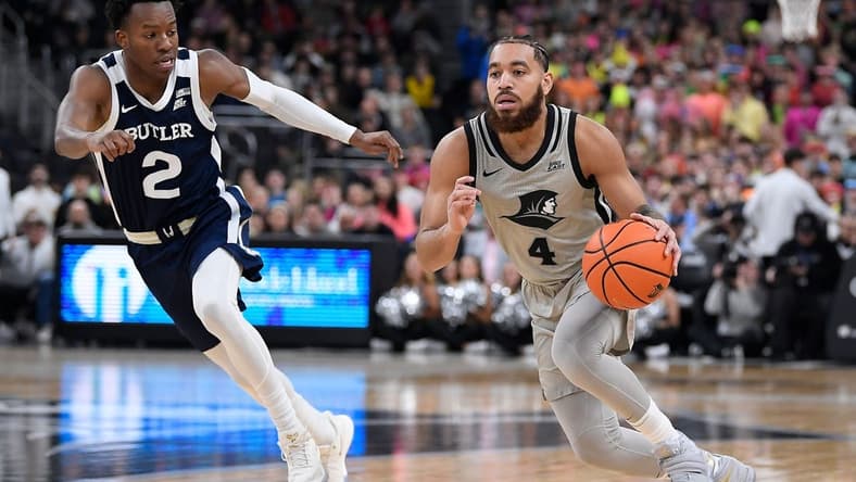 Jan 25, 2023; Providence, Rhode Island, USA; Providence Friars guard Jared Bynum (4) dribbles the ball past Butler Bulldogs guard Eric Hunter Jr. (2) during the first half at Amica Mutual Pavilion. Mandatory Credit: Eric Canha-USA TODAY Sports