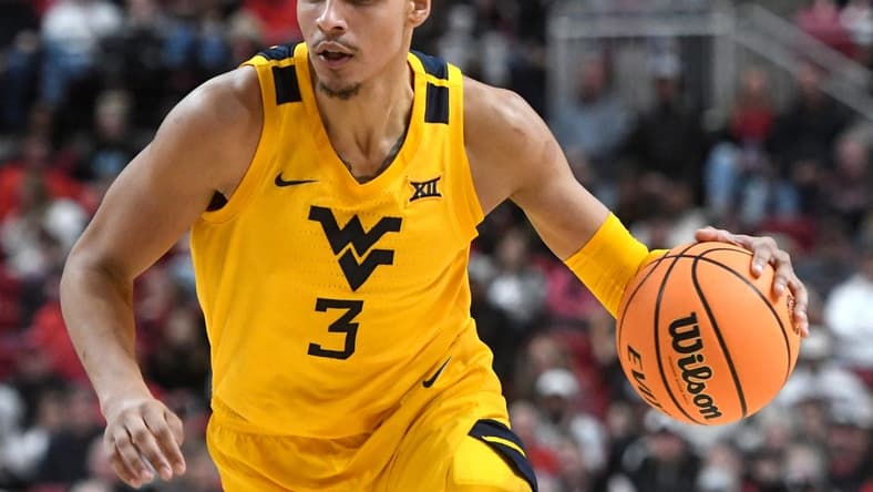 West Virginia's forward Tre Mitchell (3) dribbles the ball against Texas Tech in a Big 12 basketball game, Wednesday, Jan. 25, 2023, at United Supermarkets Arena.