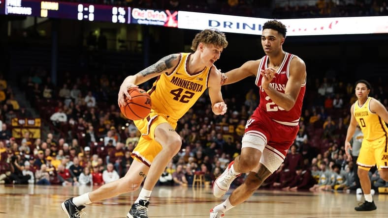 Jan 25, 2023; Minneapolis, Minnesota, USA; Minnesota Golden Gophers center Treyton Thompson (42) dribbles to the basket while Indiana Hoosiers forward Trayce Jackson-Davis (23) defends during the first half at Williams Arena. Mandatory Credit: Matt Krohn-USA TODAY Sports