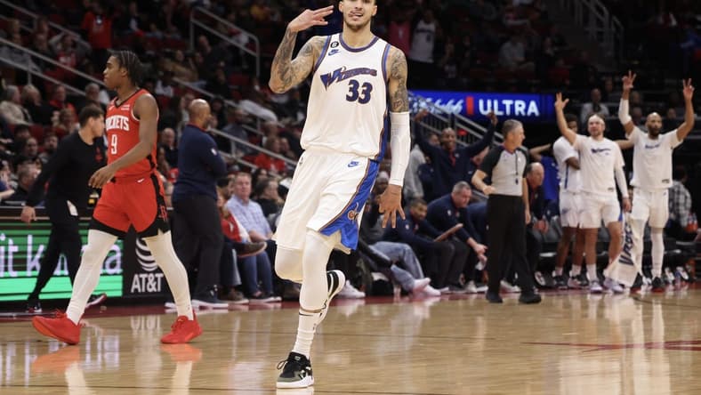 Jan 25, 2023; Houston, Texas, USA; Washington Wizards forward Kyle Kuzma (33) celebrates his three point basket against the Houston Rockets in the fourth quarter at Toyota Center. Mandatory Credit: Thomas Shea-USA TODAY Sports