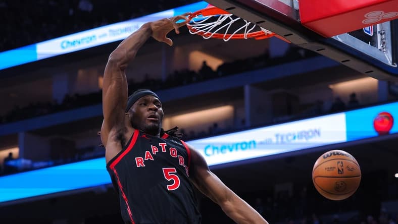 Jan 25, 2023; Sacramento, California, USA; Toronto Raptors center Precious Achiuwa (5) dunks against the Sacramento Kings during the first quarter at Golden 1 Center. Mandatory Credit: Kelley L Cox-USA TODAY Sports